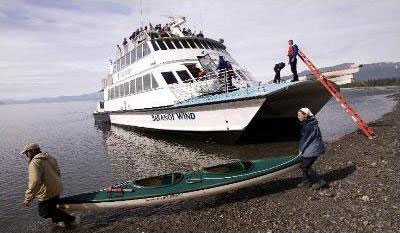 Camper transport boat unloading kayakers Camper transport boat unloading kayakers